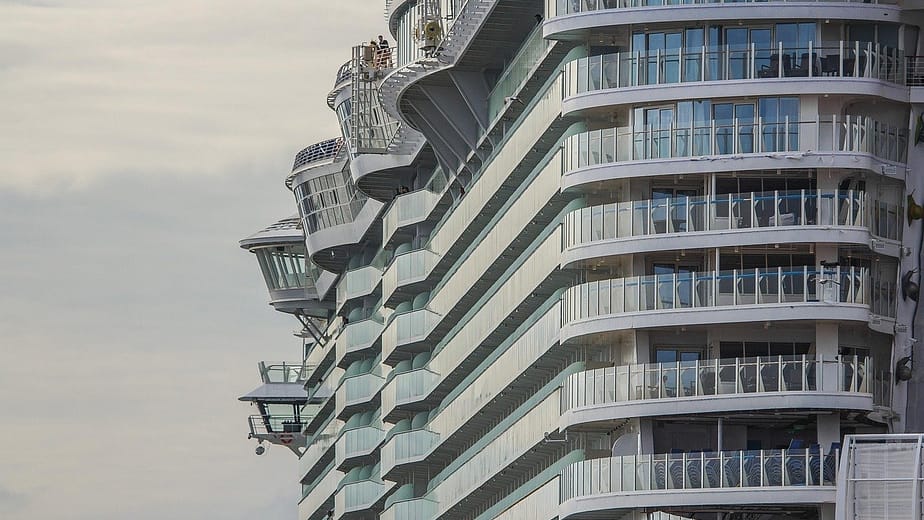 Professional chauffeur meeting passengers at Heathrow for a Southampton cruise transfer
